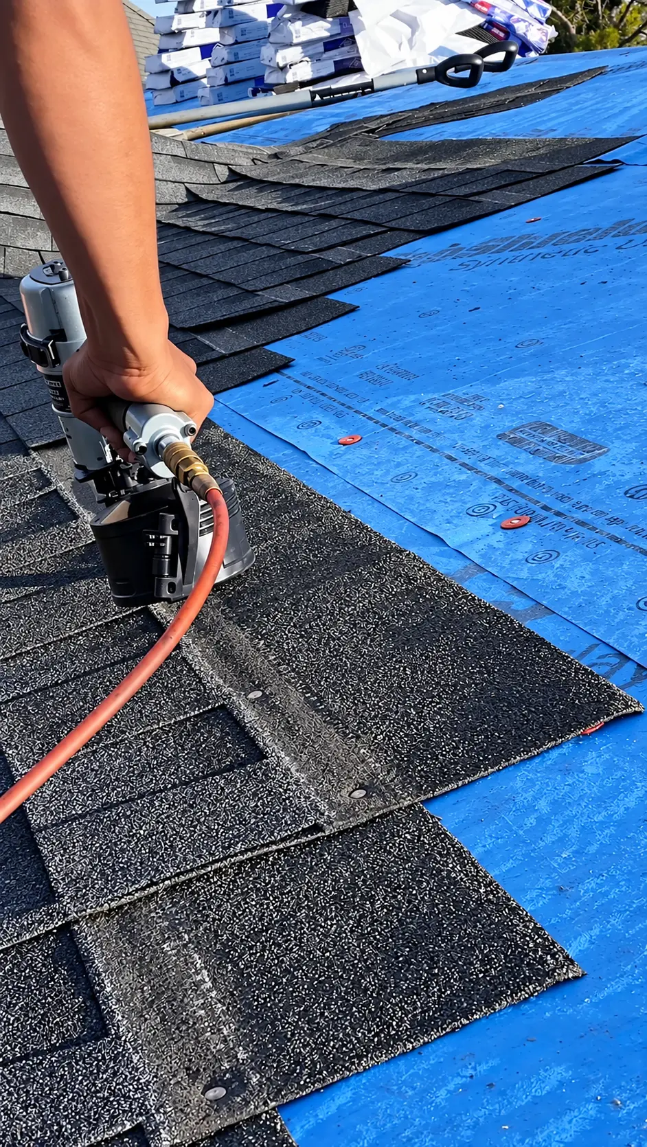 Close-up of shingles being installed on a roof